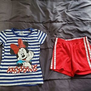 girl 6 Minnie Mouse tee and red drifit shorts